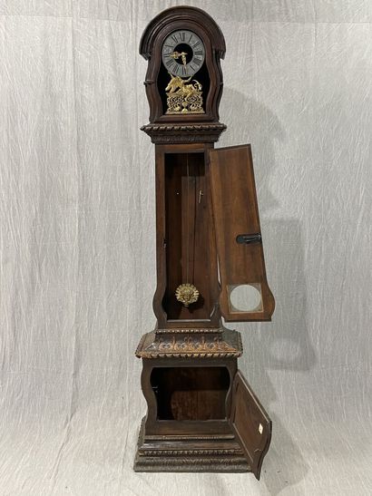 Carved oak floor clock, pewter dial supported...