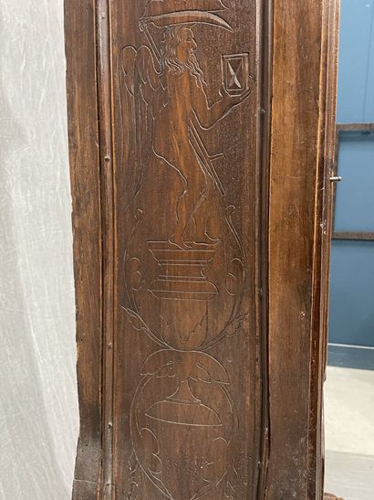 Carved oak floor clock, pewter dial supported...