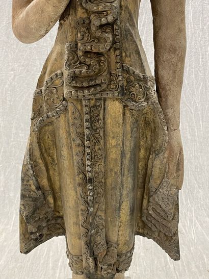 Standing Buddha.
Smiling youthful face, right...
