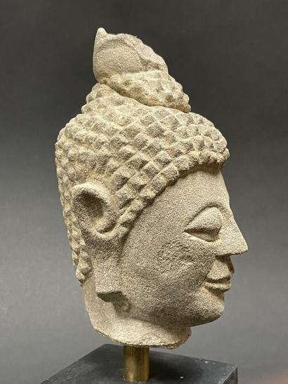 Old smiling Buddha head. Stoneware sculpture.
Siam...