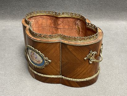 Wood veneer planter with bronze ornamentation....