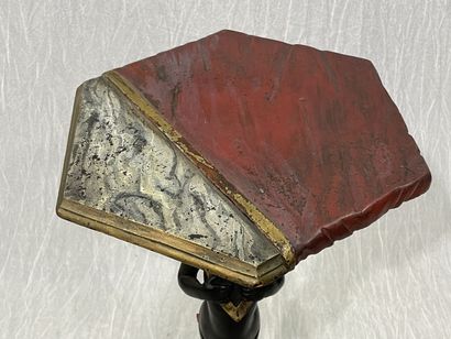 Carved wood pedestal table with patina, featuring...