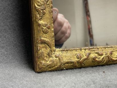 Gilded stucco frame mirror with scrolled...