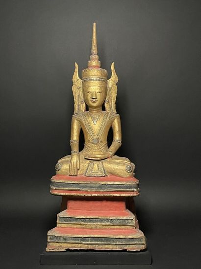 Buddha adorned in the royal effigy, wearing...