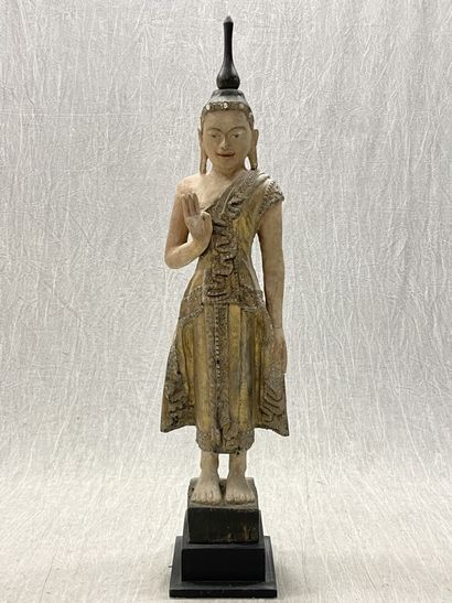 Standing Buddha.
Smiling youthful face, right...