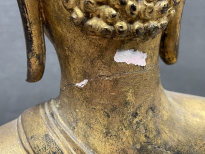 Buddha seated in virasana on a plinth adorned...
