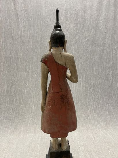 Standing Buddha.
Smiling youthful face, right...