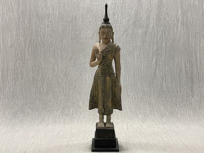 Standing Buddha.
Smiling youthful face, right...