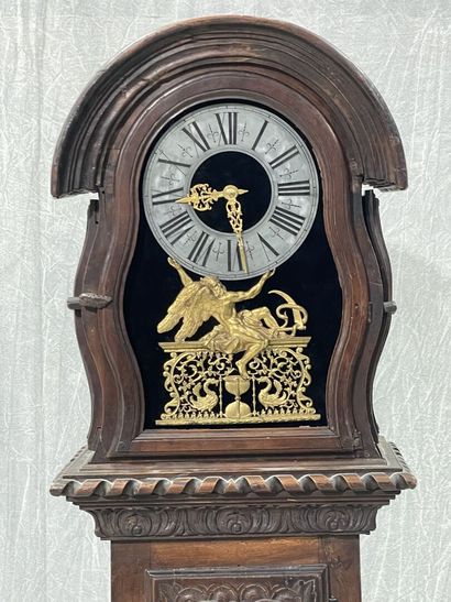 Carved oak floor clock, pewter dial supported...