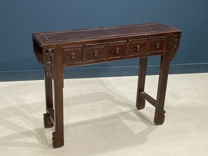 Console en bois exotique ouvrant à cinq tiroirs...