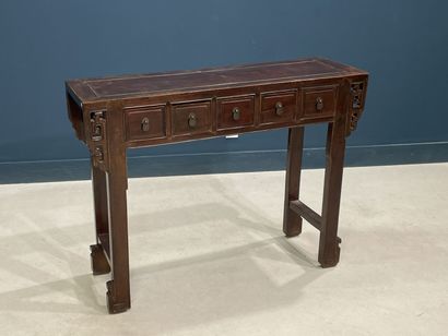 Console en bois exotique ouvrant à cinq tiroirs...