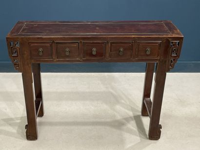 Console en bois exotique ouvrant à cinq tiroirs...