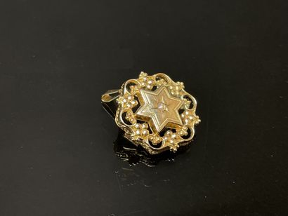 Pendentif-broche en or à décor d'étoile et...