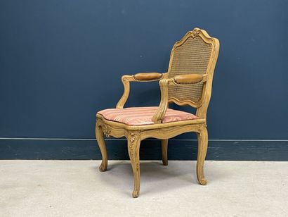 Carved and patinated beechwood armchair with...