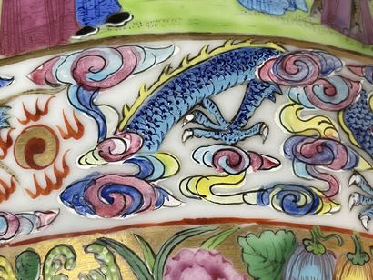 Pair of polychrome porcelain vases, richly...