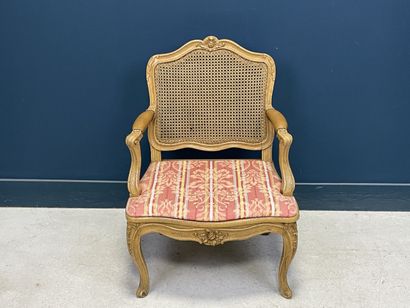 Carved and patinated beechwood armchair with...