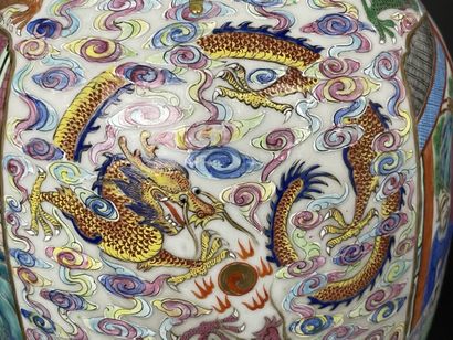 Pair of polychrome porcelain vases, richly...
