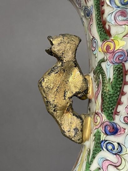 Pair of polychrome porcelain vases, richly...