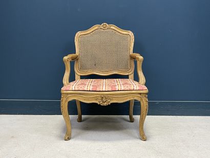 Carved and patinated beechwood armchair with...