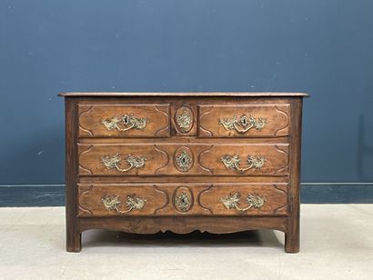 Moulded oak chest of drawers opening to four...