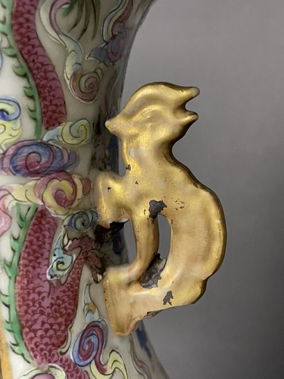 Pair of polychrome porcelain vases, richly...