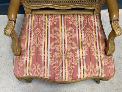 Carved and patinated beechwood armchair with...