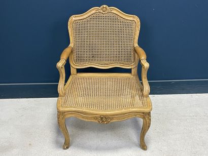 Carved and patinated beechwood armchair with...