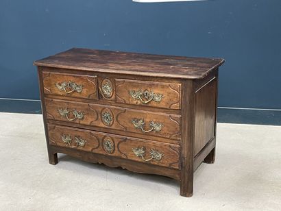 Moulded oak chest of drawers opening to four...