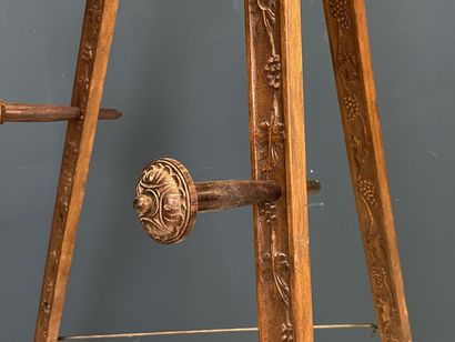 Large folding tripod easel in carved mahogany....
