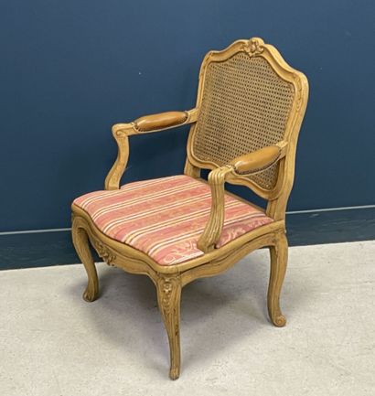 Carved and patinated beechwood armchair with...