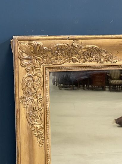 Wood and gilded stucco mirror, decorated...