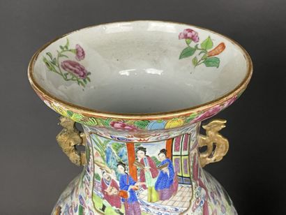 Pair of polychrome porcelain vases, richly...