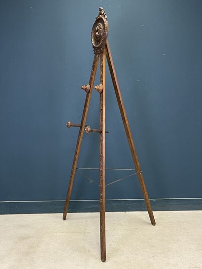 Large folding tripod easel in carved mahogany....