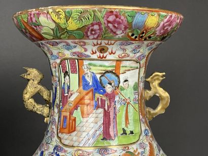Pair of polychrome porcelain vases, richly...