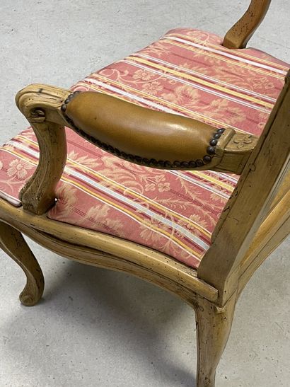 Carved and patinated beechwood armchair with...
