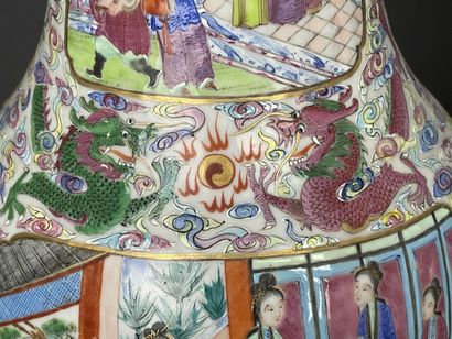 Pair of polychrome porcelain vases, richly...