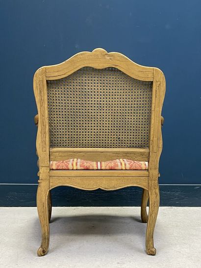 Carved and patinated beechwood armchair with...