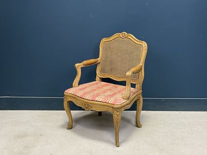 Carved and patinated beechwood armchair with...