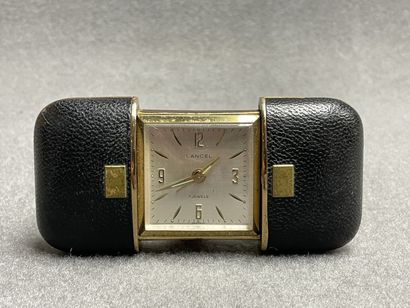 LANCEL. 
Réveil de voyage gainé de cuir....