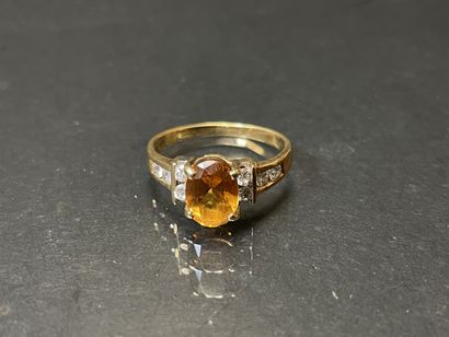 Bague en or 585°/00 sertie de topaze orange,...