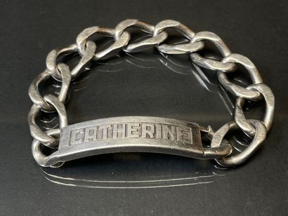 Gourmette en argent marquée CATHERINE.
L:...