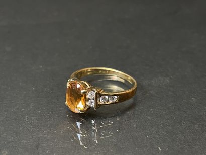 Bague en or 585°/00 sertie de topaze orange,...