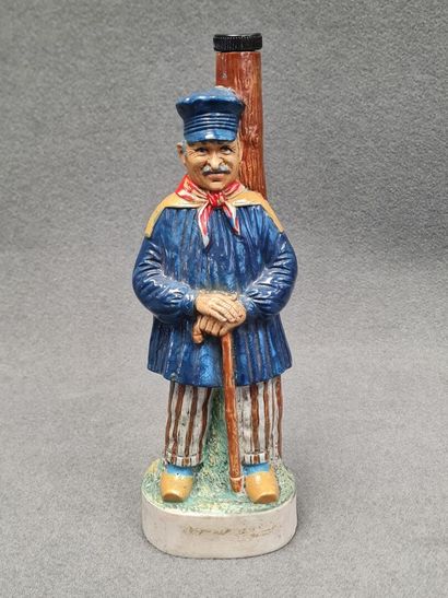 Bouteille en grés décor paysan
H. 33cm