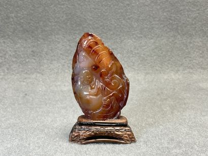 Bouddha sculpté sur une pierre.
H. :11 m...