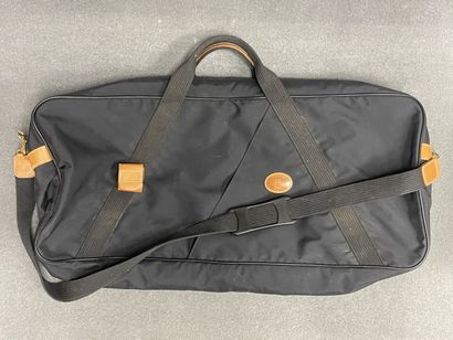 LANCEL Valise souple en toile et cuir
On...