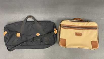 LANCEL Valise souple en toile et cuir
On...