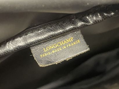 LANCEL Valise souple en toile et cuir
On...