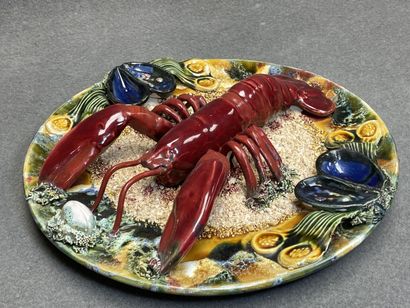 Plat en barbotine à décor de homard
Faïence...
