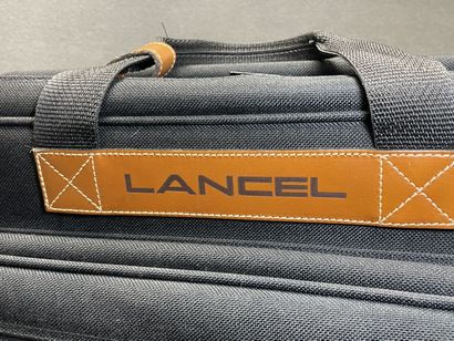 Lancel
Deux valises souples en toile noire....