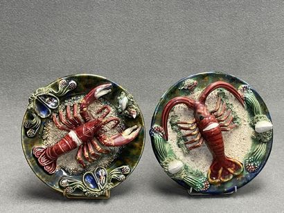 Deux plats en barbotine à décor de homard....